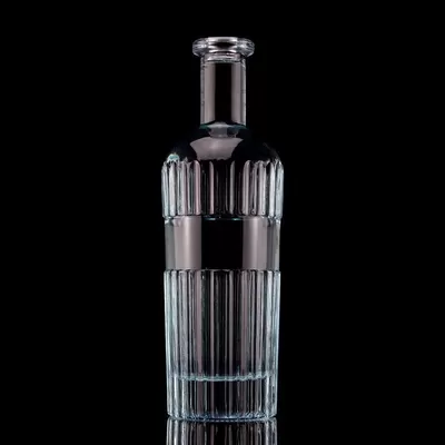 A beautiful light blue 750ml 75cl vertical bar vodka bottle with a cap made of transparent glass