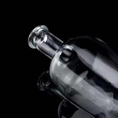 Acid-etched surface glass material for 750-milliliter capacity spirits glass bottles