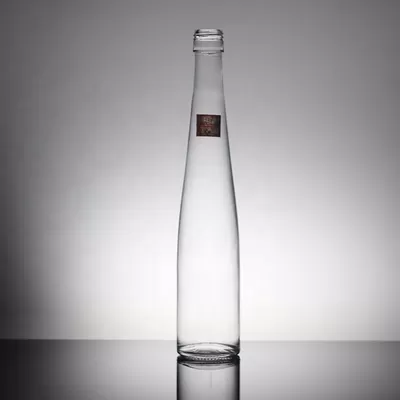 Transparent round 700ml and 350ml custom mineral water glass bottles, used for industrial beverages
