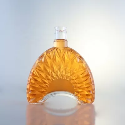 Champagne-colored 1-liter glass bottle with custom options of decal screen printing and cork seal